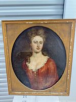 Front view of framed oval portrait