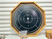 Full view of Crokinole face with bag of discs