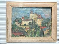 Front view of framed oil painting of European townscape