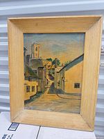 Front view of framed oil painting