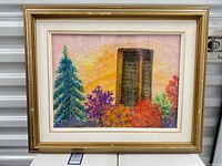 Full view of framed watercolour painting in gold frame