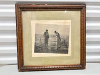 Framed print showing entire piece within carved wood frame