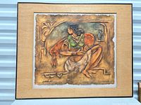 Front view of framed embossed mixed media artwork