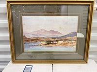 Full view of framed watercolour under glass