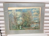 Front view of matted springtime landscape print under glass