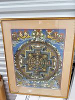 Full view of framed mandala silk screen with frame and mat