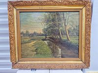 Front view of framed painting showing artwork and frame