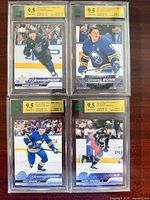 Front view of four graded Upper Deck Young Guns hockey cards