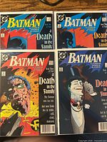 Four bagged comics issues #426-429 laid out