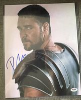 Signed 11x14 photograph showing Russell Crowe in armour with blue ink autograph