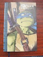 Front cover showing title, character art and spine