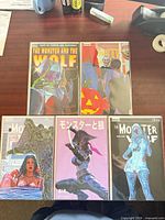 All five variant covers laid out on table