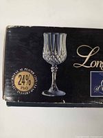 Box corner showing Longchamp goblet image and 24% PbO mark