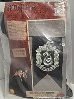 Factory-sealed package showing banner, branding and included items