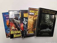 Front view of all five DVD cases upright