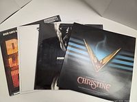 Group shot of all four album jackets partially overlapped