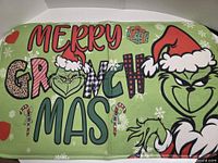 Full view of Merry Grinchmas bath mat showing complete design and text