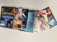 All seven DVD cases side view