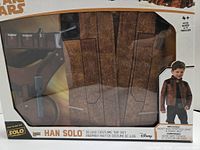 Front of boxed Han Solo costume set showing jacket and belt
