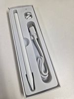 Stylus pen, USB-C cable and spare tips seated in molded tray
