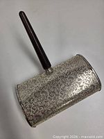 Front view showing etched barrel body and wood handle