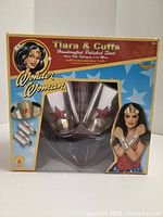 Front view of boxed Wonder Woman tiara and cuffs set