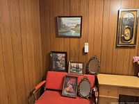 Overall lot showing one wall clock, three prints and two ornate mirrors