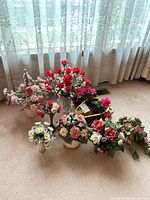 Group shot of all faux floral arrangements showing variety of containers and blooms