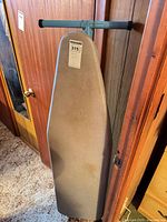 Front view of ironing board with cover