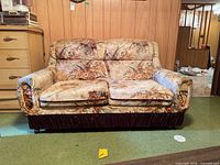 Front view of two-seat floral sofa