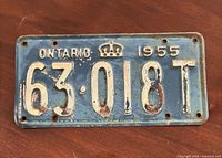 Front view showing full plate, lettering, crown and serial