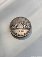 Reverse showing CANADA 1959 DOLLAR Voyageur design