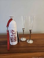 Bottle and two flutes on table