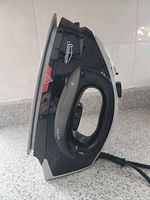 Left side view of the Sunbeam steam iron showing water level window and cord