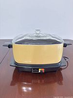 Cooker assembled with lid, front view showing controls