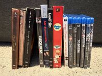 Spines of 12 movie cases showing all titles and formats