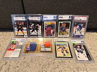 Ten graded hockey cards in two rows showing fronts and grade labels