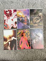 Front covers of six bagged comic books