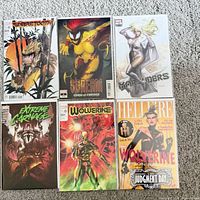 All six bagged and boarded Marvel comic books laid out on carpet