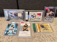 Group shot of all seven cards in holders