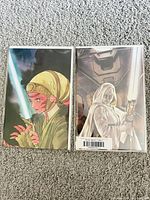 Front view of two bagged and boarded Star Wars variant comics showing distinct female Jedi cover art