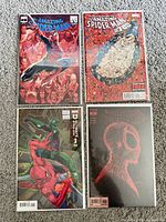 All four bagged Spider-Man comic issues displayed front covers