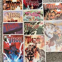 Nine bagged and boarded Thor comic books arranged in three-by-three grid
