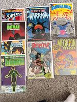 Front view of all eight bagged comics showing covers