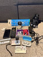 Group shot of all electronics and LEGO Darth Vader figure on carpet