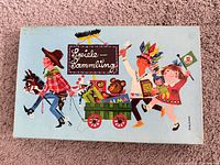 Blue lid with illustrated cart and characters