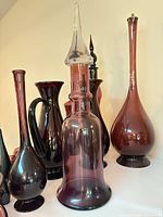 Group shot showing decanter, multiple vases and pitcher