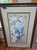 Framed print of blue and white egret with blossoms in ornate frame