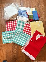 All linens laid out showing variety of colors and patterns