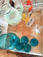 Tray showing full assortment including pitcher, teal, peach, floral and duck glasses